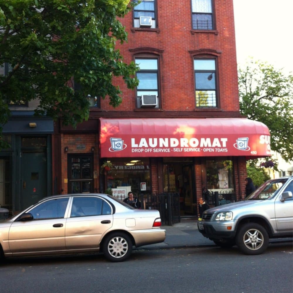 Mars Laundromat's original red awning storefront, before it was replaced after hurricane damage